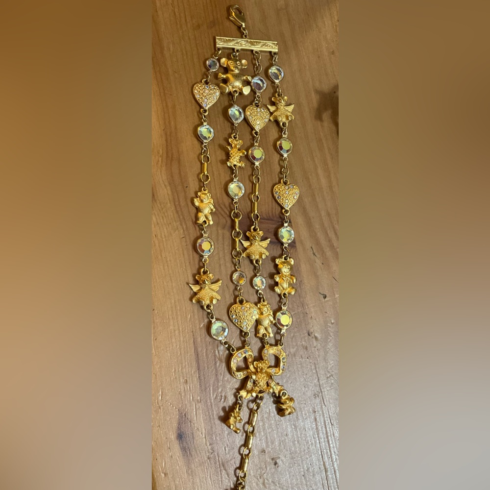 Kirk’s Folly: 4 strands teddy bear with wings,hearts with rhinestones bracelet